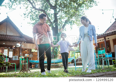 asian little family enjoying leisure time outdoors 120499120