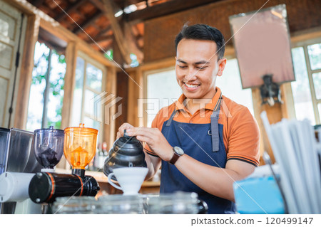 male barista working making drip coffee 120499147
