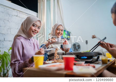 Savoring a Warm and Cozy Dinner Experience with Friends in the Comfort of Home Savoring a Warm and Cozy Dinner Experience with Friends in the Comfort of Home 120499660
