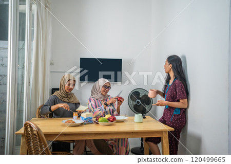 Family Gathering Cherished Moments at a Cozy Table, creating lasting bonds 120499665