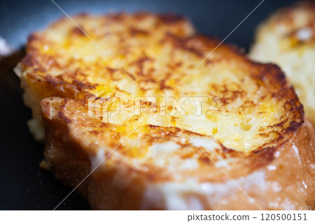 French toast being cooked in a frying pan (stock photo) French toast being cooked in a frying pan (stock photo) 120500151