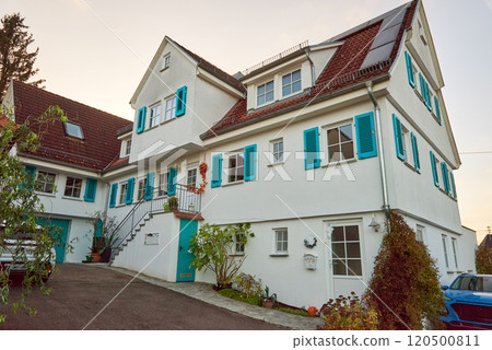Charming Traditional German Townhouse with Vibrant Turquoise Shutters 120500811