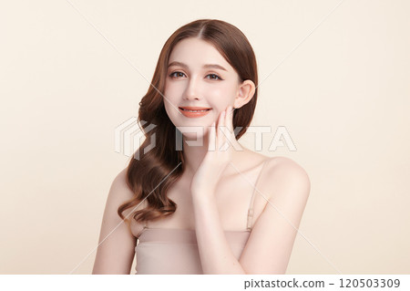 Beautiful young asian woman with clean fresh skin on beige background, Face care, Facial treatment, Cosmetology, beauty and spa, Asian women portrait. Beautiful young asian woman with clean fresh skin on beige background, Face care, Facial treatment, Cosmetology, beauty and spa, Asian women portrait. 120503309