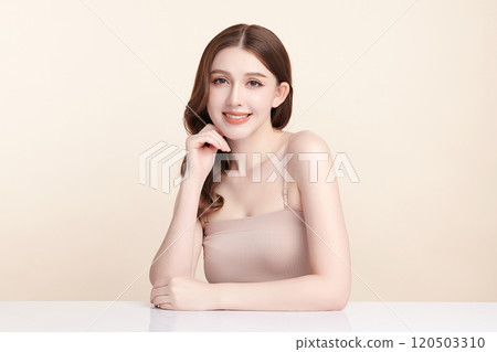 Beautiful young asian woman with clean fresh skin on beige background, Face care, Facial treatment, Cosmetology, beauty and spa, Asian women portrait. 120503310