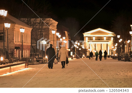 Age couple, walking in the snow between the main street Age couple, walking in the snow between the main street 120504343