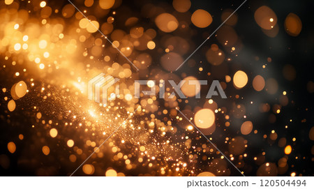 Golden bokeh lights on a dark backdrop. 120504494