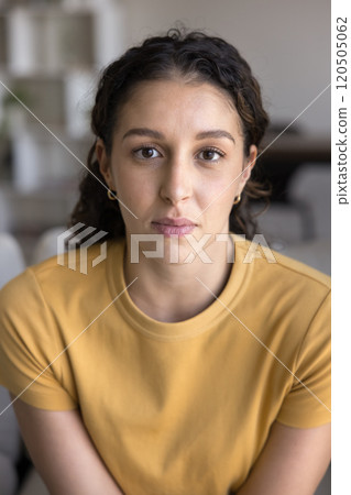 Serious beautiful young Latin woman looking at camera 120505062