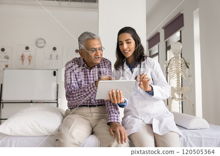 GP showing to patient health condition test result on tablet 120505364