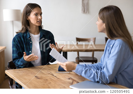 Female candidate engaged in conversation, using hand gestures Female candidate engaged in conversation, using hand gestures 120505491