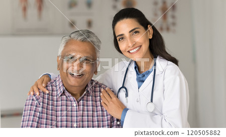Portrait of happy older man and nurse posing for camera Portrait of happy older man and nurse posing for camera 120505882