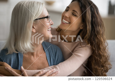 Affectionate and joyful moment between mother and grown-up daughter 120506024