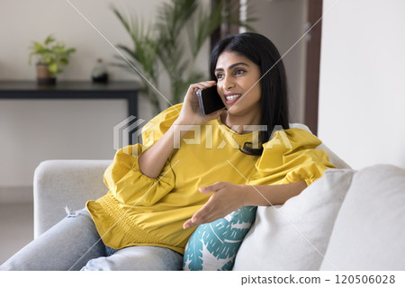 Positive beautiful Indian woman making telephone call 120506028