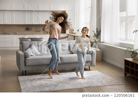 Carefree woman dancing together with little 6s daughter Carefree woman dancing together with little 6s daughter 120506161