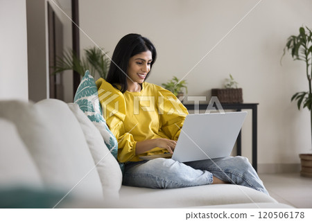 Positive Indian freelancer girl using Internet technology 120506178