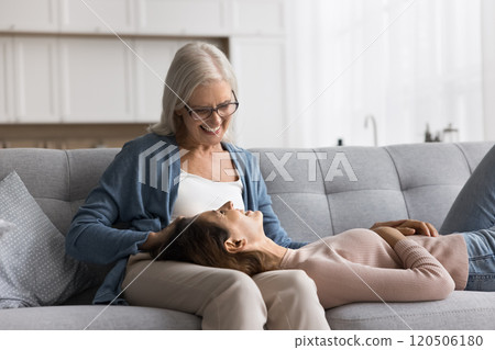 Older pensioner woman enjoy time and pleasant talk with daughter 120506180