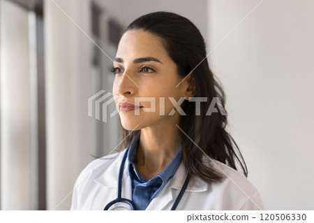 Beautiful young 30s Latina therapist or cardiologist, head shot portrait 120506330