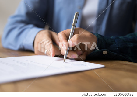 Businesspeople gathered at business meeting after successful negotiations signing contract Businesspeople gathered at business meeting after successful negotiations signing contract 120506352