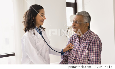 Cardiologist checks heartbeat of older man hospital patient Cardiologist checks heartbeat of older man hospital patient 120506417