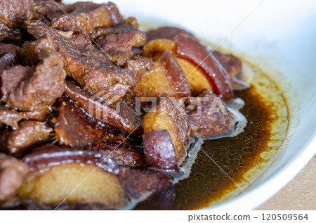 Close up of pork cooked in soy sauce with customizable space for text. Asian food concept 120509564