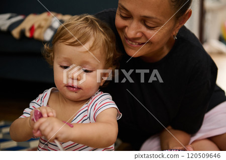 A joyful moment captured between a loving mother and her young child as they spend quality time together in a cozy home setting. 120509646