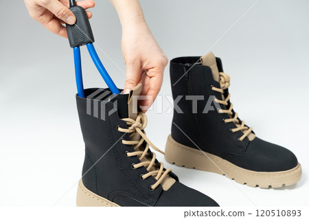 Electric shoe dryer placed in boots Electric shoe dryer placed in boots 120510893