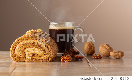 Dessert with walnuts and coffee on a beige background. Dessert with walnuts and coffee on a beige background. 120510960