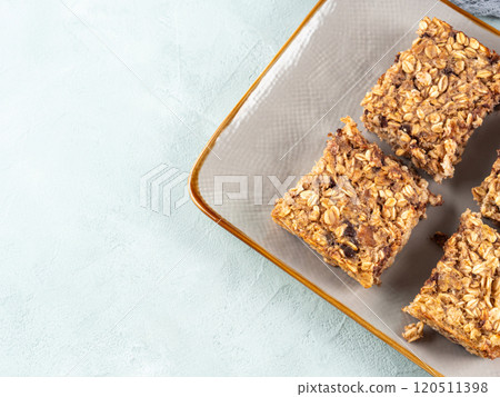 Baked oatmeal peanut butter banana cake bars with chocolate chips 120511398