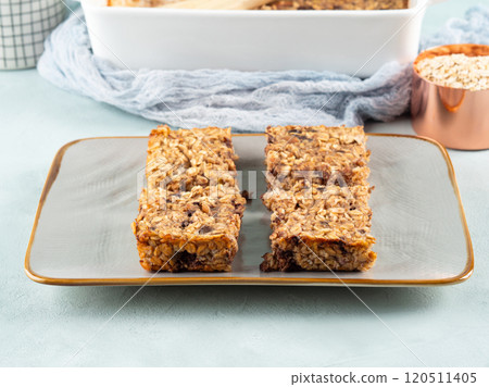 Baked oatmeal peanut butter banana cake bars with chocolate chips 120511405