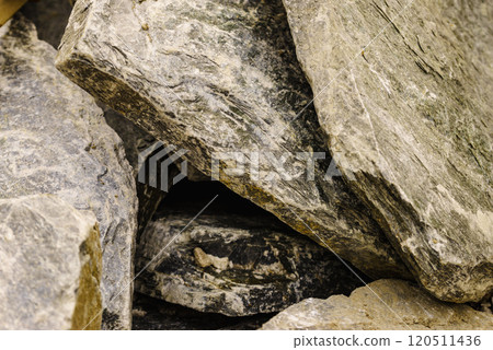 Stone masonry material on construction site 120511436