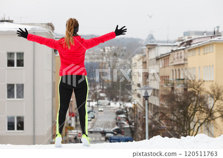 Woman exercising during winter 120511763