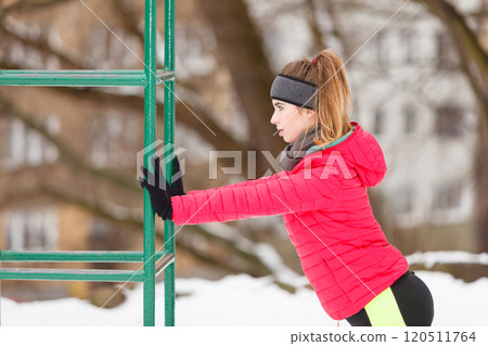 Woman urban exercising outside during winter 120511764