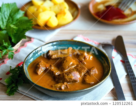 Delicious goulash made from deer meat in a bowl. 120512261