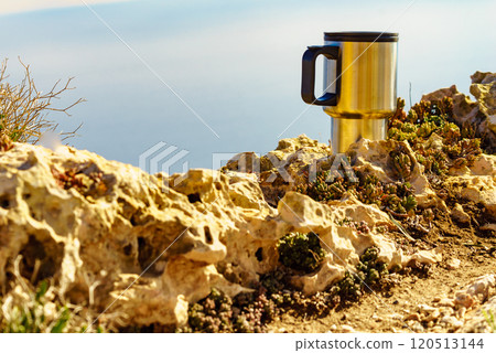 Thermal mug, thermos on nature. Travel outdoor picnic. 120513144