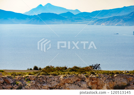 Coast view with two bicycles on shore 120513145