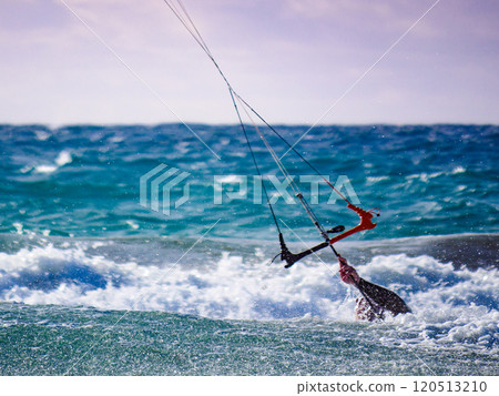 Kite surfer in sea waves. Kiteboarding sport. 120513210