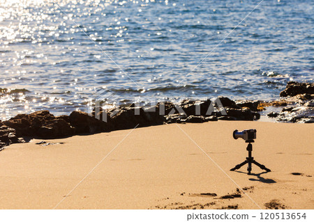 Camera taking picture film of sea coast 120513654