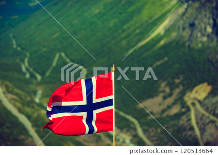 Norwegian flag and Trollstigen mountain road Norwegian flag and Trollstigen mountain road 120513664