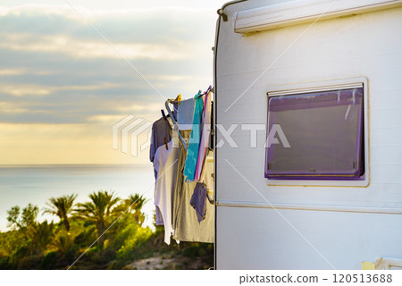 Caravan on sea with clothes to dry Caravan on sea with clothes to dry 120513688