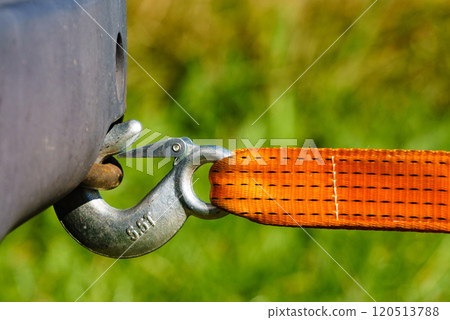 Tow hook with orange strap on car. Towing equipment. Tow hook with orange strap on car. Towing equipment. 120513788