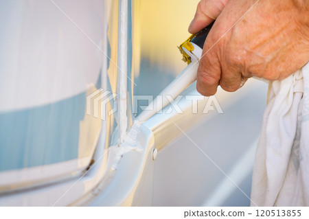 Applying silicon on caravan body Applying silicon on caravan body 120513855