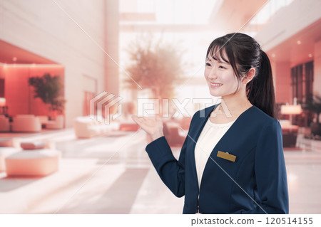 Young woman serving customers at a hotel 120514155