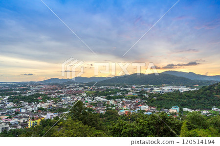 Aerial view of Phuket from Khao Rang hill, highlighting urban and natural scenery under a colorful evening sky. 120514194