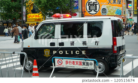 Police car patrolling on the roads of Akihabara pedestrian paradise, Tokyo, Japan, October 27, 2024 120515674