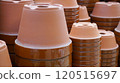 Many red clay flower pots are piled up 120515697