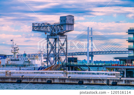 Yokohama cityscape in Japan. An airplane passes by (center back). View of Yokohama Hammerhead and Yokohama Bay Bridge, etc. = 23rd Yokohama cityscape in Japan. An airplane passes by (center back). View of Yokohama Hammerhead and Yokohama Bay Bridge, etc. = 23rd 120516114