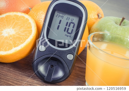 Glucometer, fresh fruits and orange juice Glucometer, fresh fruits and orange juice 120516959
