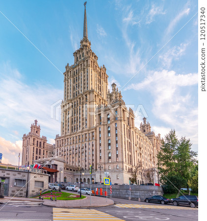 high-rise stalinist building near river at summer sunset in Moscow, Russia. Historic name is Hotel Ukraine. high-rise stalinist building near river at summer sunset in Moscow, Russia. Historic name is Hotel Ukraine. 120517340