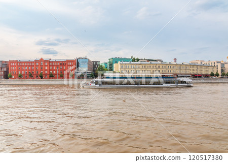 Cruise ship sails on the Moscow river in Moscow city center, popular place for walking. 120517380