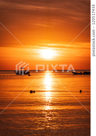 Beautiful red and orange sunrise over the sea. Beautiful red and orange sunrise over the sea. 120517438