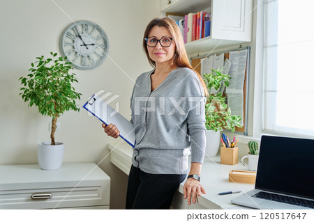 Portrait of woman mental specialist psychologist with clipboard folder Portrait of woman mental specialist psychologist with clipboard folder 120517647
